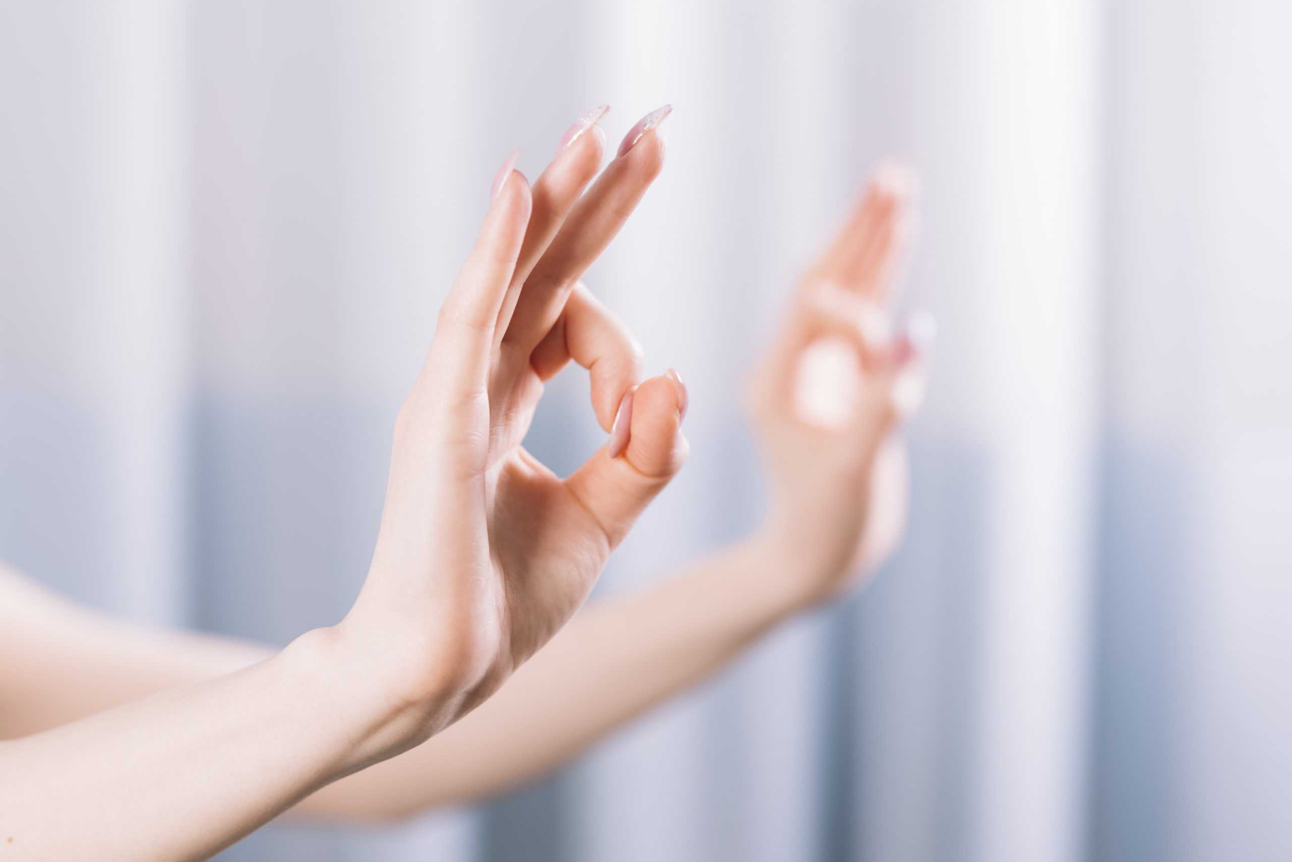 close-up-hand-showing-gyan-mudra-gesture-scaled